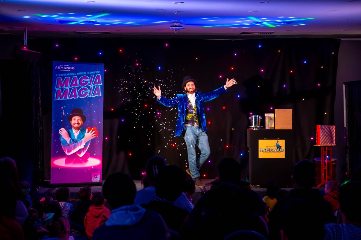 The Great Armando welcoming children during a birthday party magician show in Melbourne