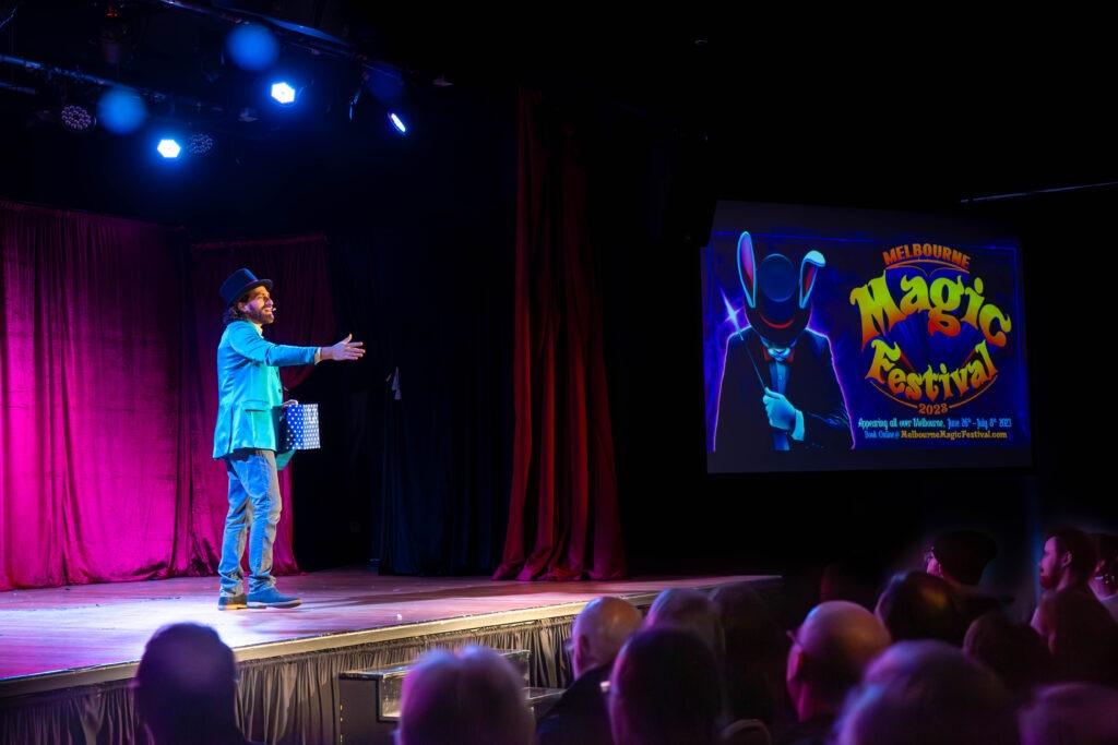 Armando on a big stage with the audince in the front